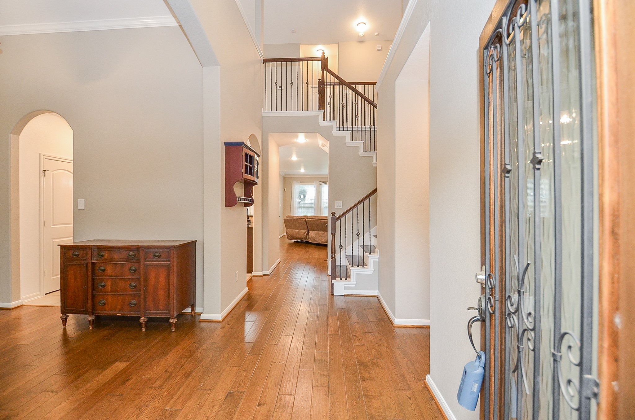 1510 Kent Valley Lane Rosenberg, TX 77471 - Photo 5 of 33 a view of a hallway with wooden floor and staircase