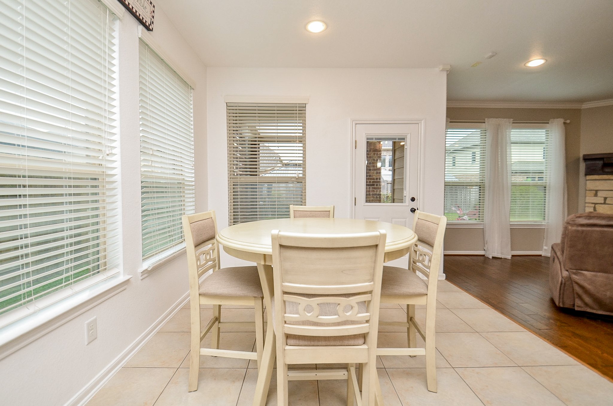 1510 Kent Valley Lane Rosenberg, TX 77471 - Photo 10 of 33 a dining room with wooden floor and large windows