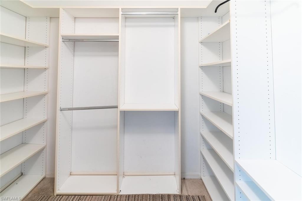 1031 Ridge Street Naples, FL 34103 - Photo 14 of 38 View of walk in closet in primary bedroom