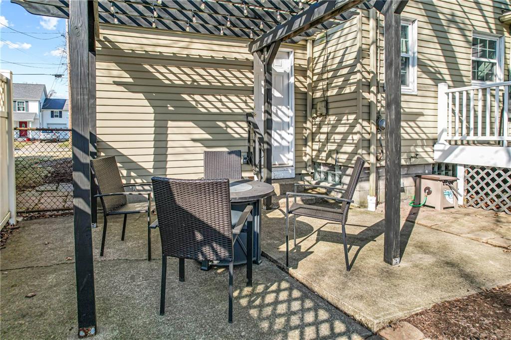 959 Mayfield Road Sharpsville, PA 16150 - Photo 41 of 49 Concrete patio, pergola- a pleasant viewing area to the fenced in back yard to enjoy watching your (fur)babies play