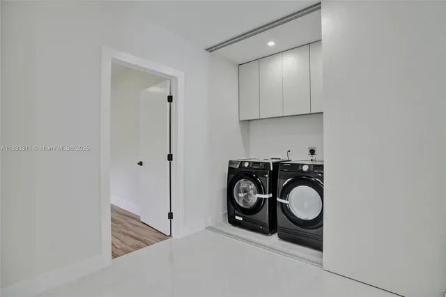 a close view of a storage and utility room with washer and dryer