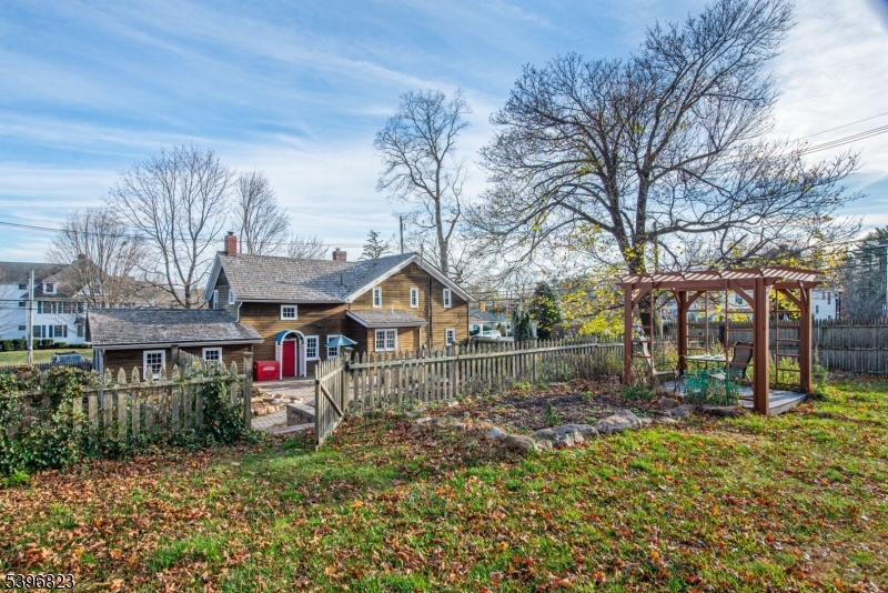 111 Main Street Succasunna, NJ 07876 - Photo 20 of 45 a front view of a house with a yard