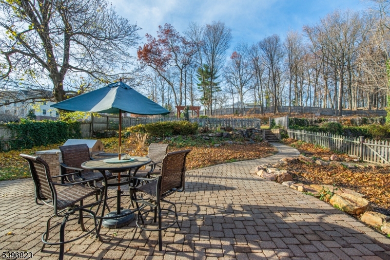111 Main Street Succasunna, NJ 07876 - Photo 21 of 45 a view of backyard with seating space and trees