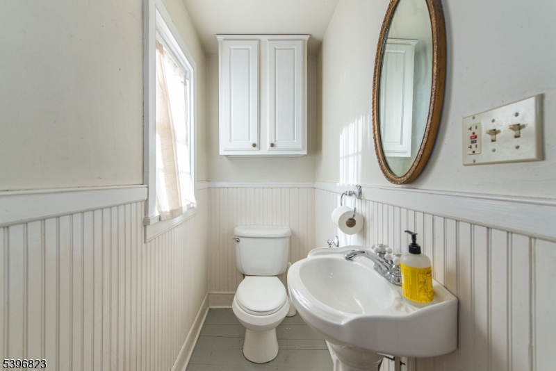 111 Main Street Succasunna, NJ 07876 - Photo 31 of 45 a bathroom with a toilet and a sink