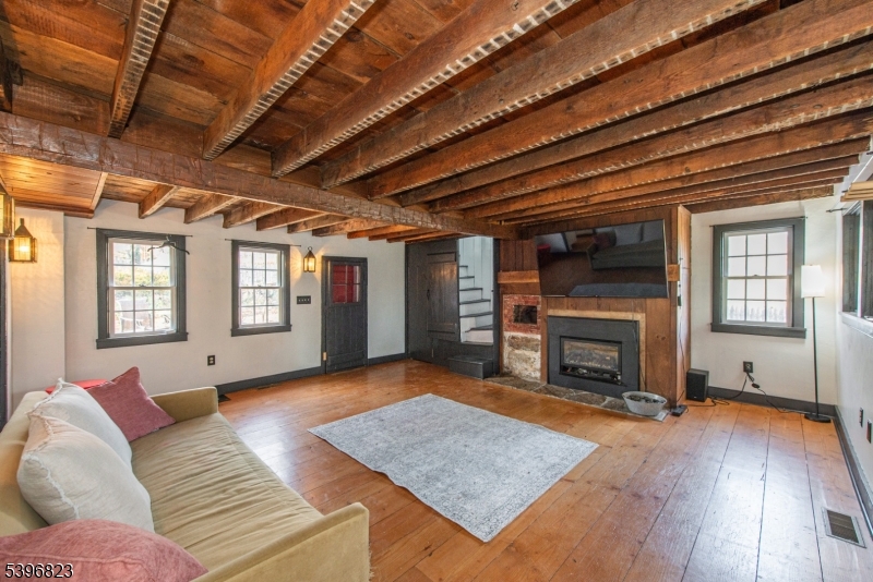 111 Main Street Succasunna, NJ 07876 - Photo 37 of 45 a living room with furniture and a fireplace