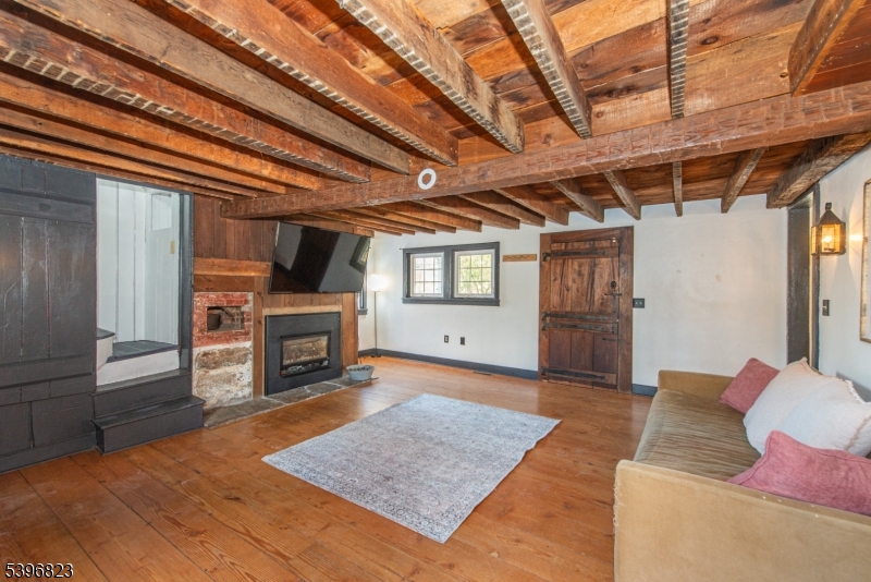 111 Main Street Succasunna, NJ 07876 - Photo 38 of 45 a living room with furniture and a fireplace
