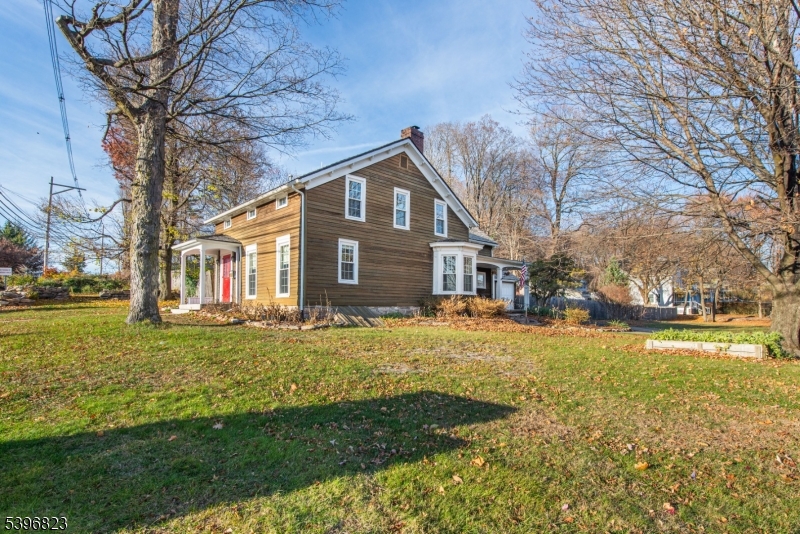 111 Main Street Succasunna, NJ 07876 - Photo 5 of 45 a front view of a house with a yard