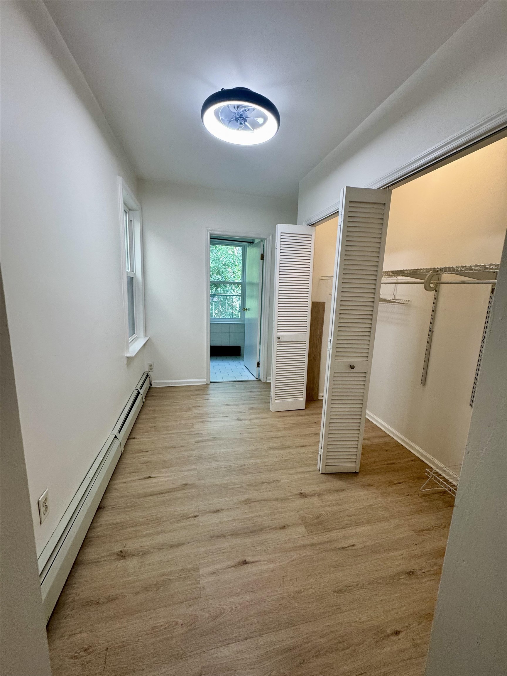 421 Adams Street, Unit 2L Hoboken, NJ 07030 - Photo 9 of 19 a view of a room with wooden floor and stairs