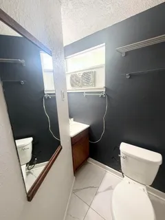 a kitchen with a stove and a microwave