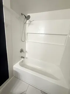 a kitchen with a refrigerator and a window