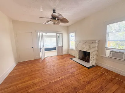 a bedroom with a bed and a lamp