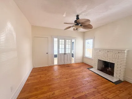 a kitchen with stainless steel appliances granite countertop a stove a refrigerator and a cabinets