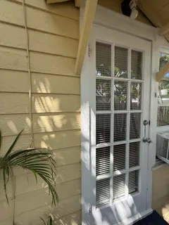 a view of front door and wooden floor