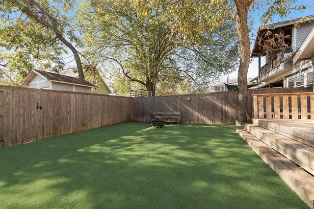 a backyard of a house with lots of green space