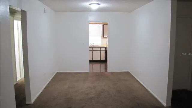 a view of an empty room and window