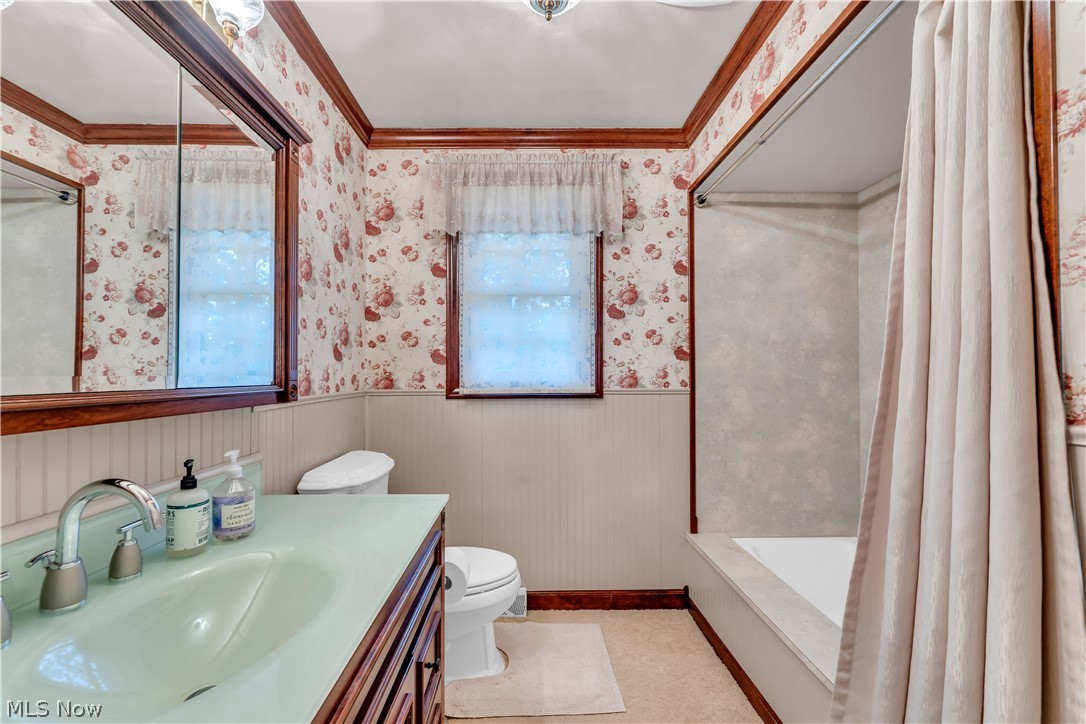 9897 West Ridge Road Elyria, OH 44035 - Photo 24 of 43 Full bathroom featuring ornamental molding, toilet, shower / tub combo, and oversized vanity