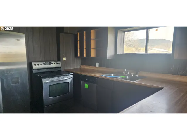 a view of a kitchen with a sink