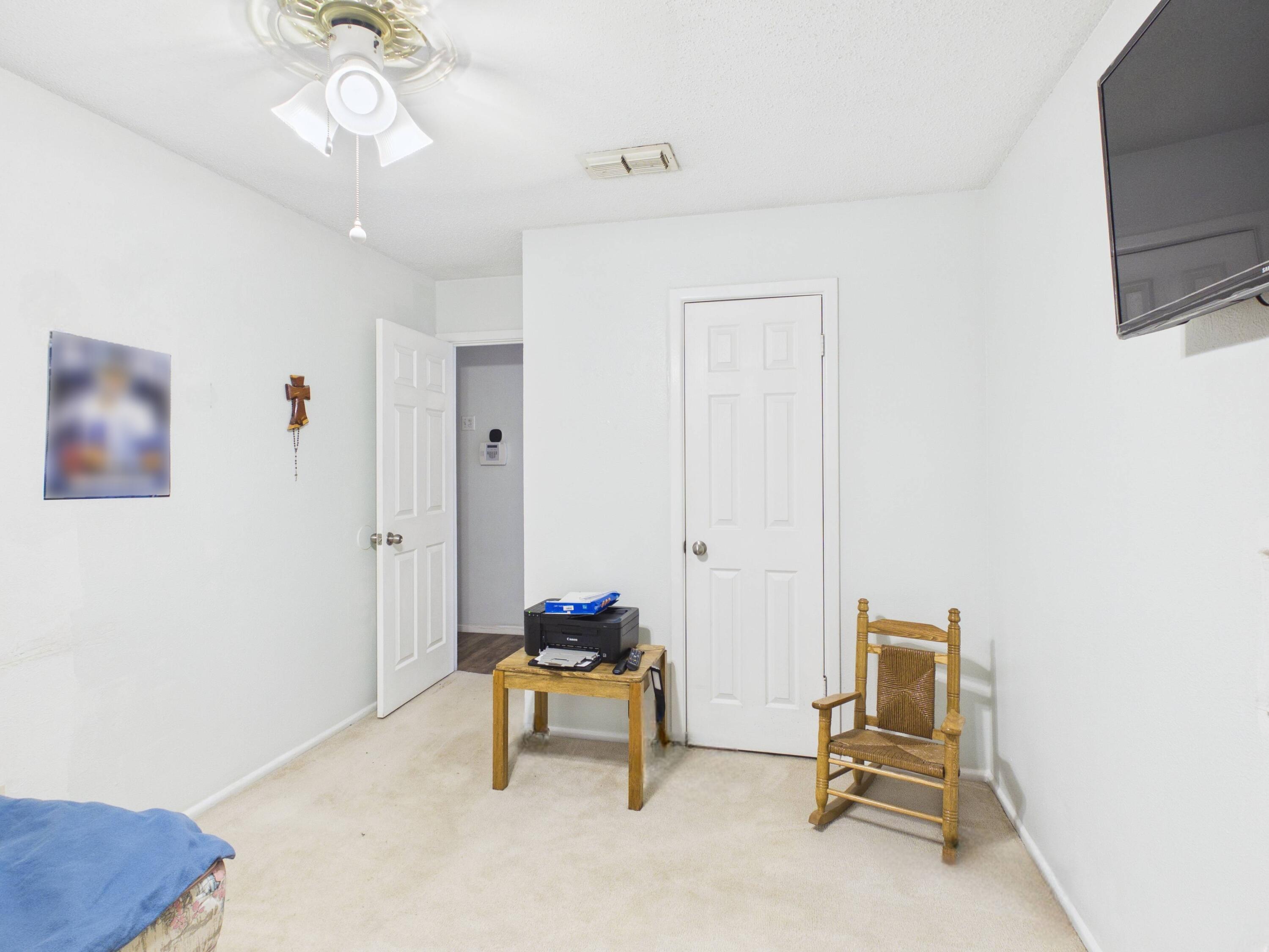4825 10th Street Lubbock, TX 79416 - Photo 16 of 27 a view of a livingroom with furniture and a window