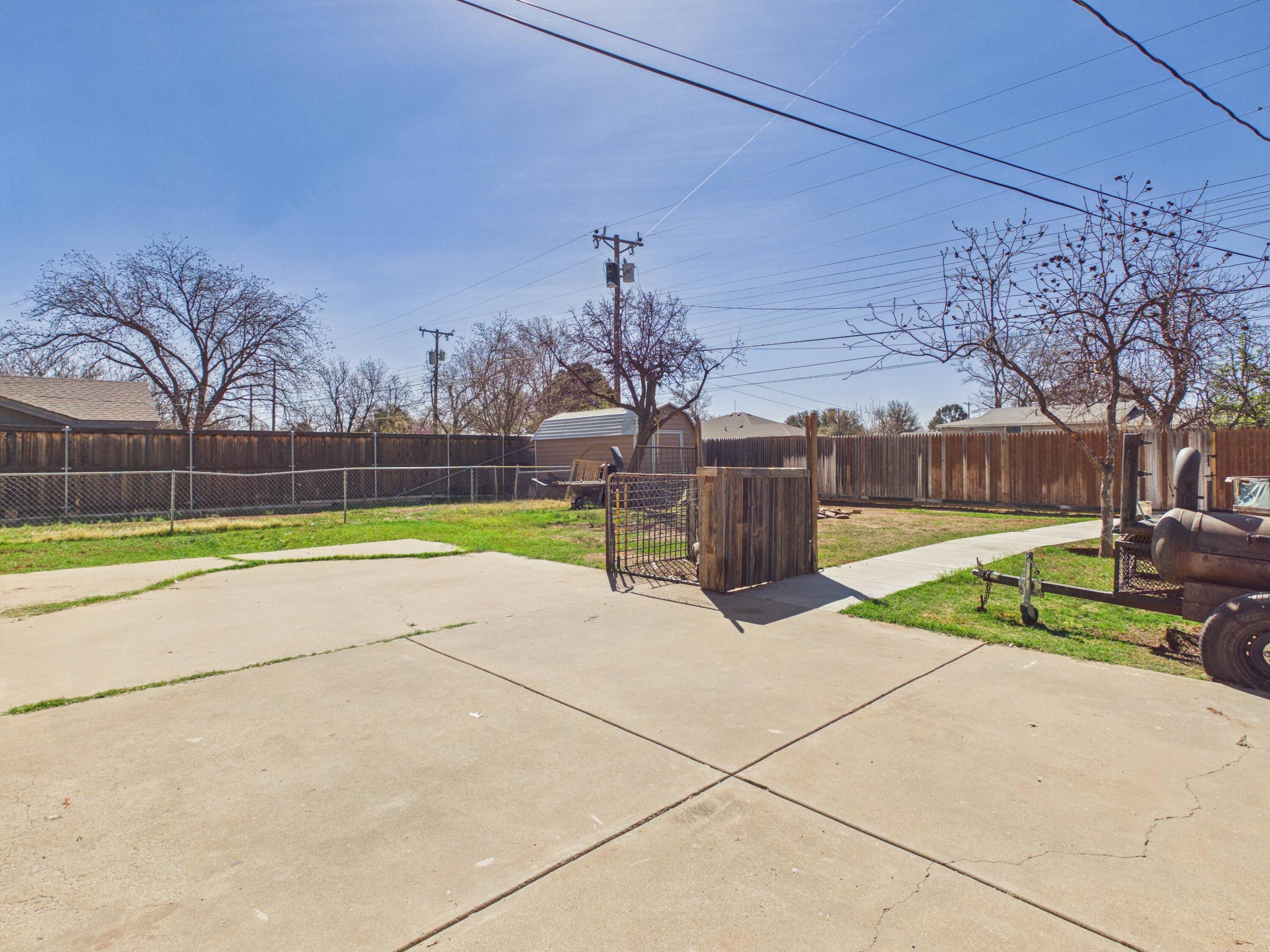 4825 10th Street Lubbock, TX 79416 - Photo 25 of 27 a view of yard with swimming pool and seating area