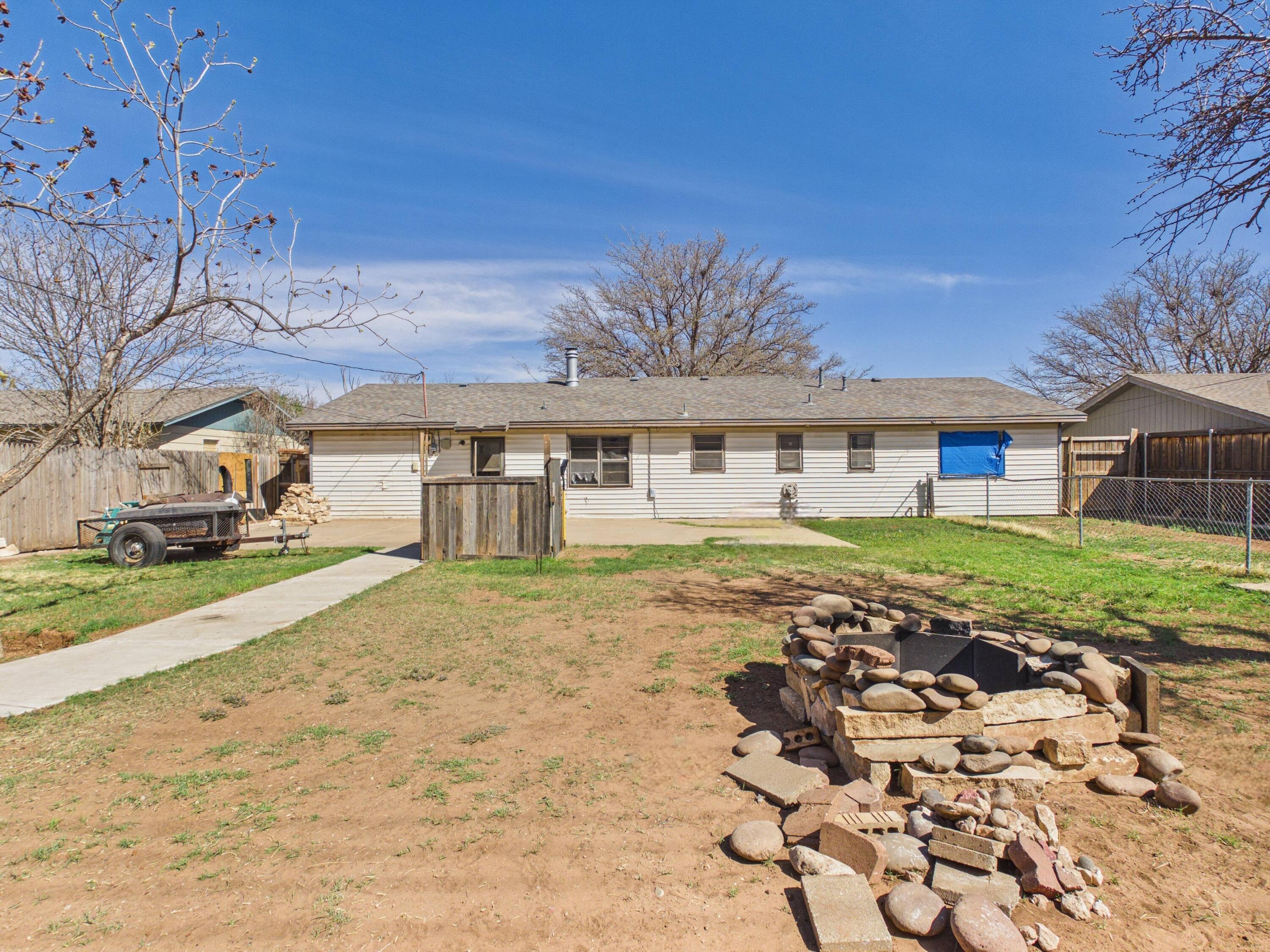 4825 10th Street Lubbock, TX 79416 - Photo 27 of 27 front view of a house with a yard