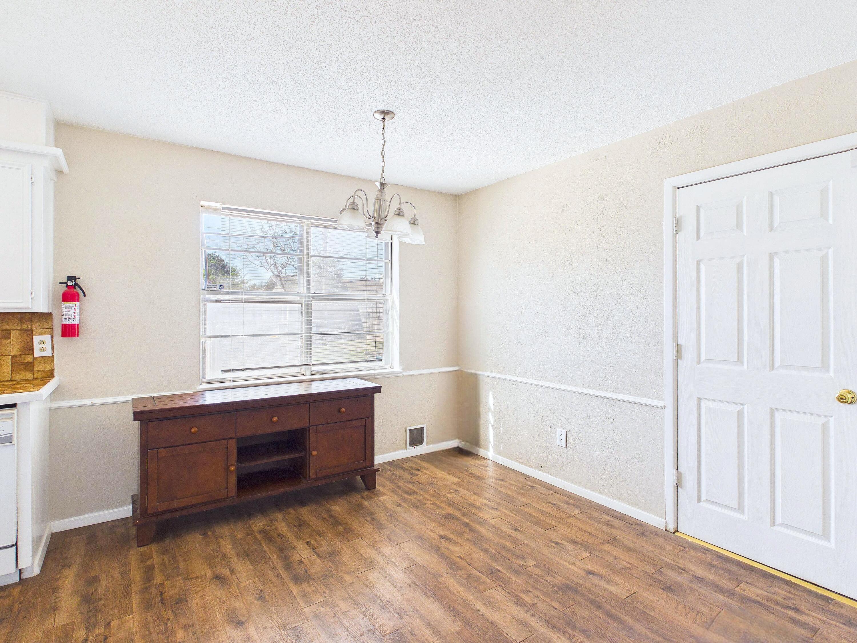 4825 10th Street Lubbock, TX 79416 - Photo 9 of 27 a room with furniture and window
