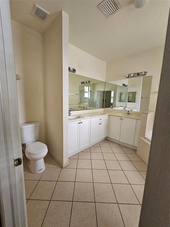 23519 Southwest 112th Court Homestead, FL 33032 - Photo 12 of 19 a bathroom with a sink a toilet and mirror
