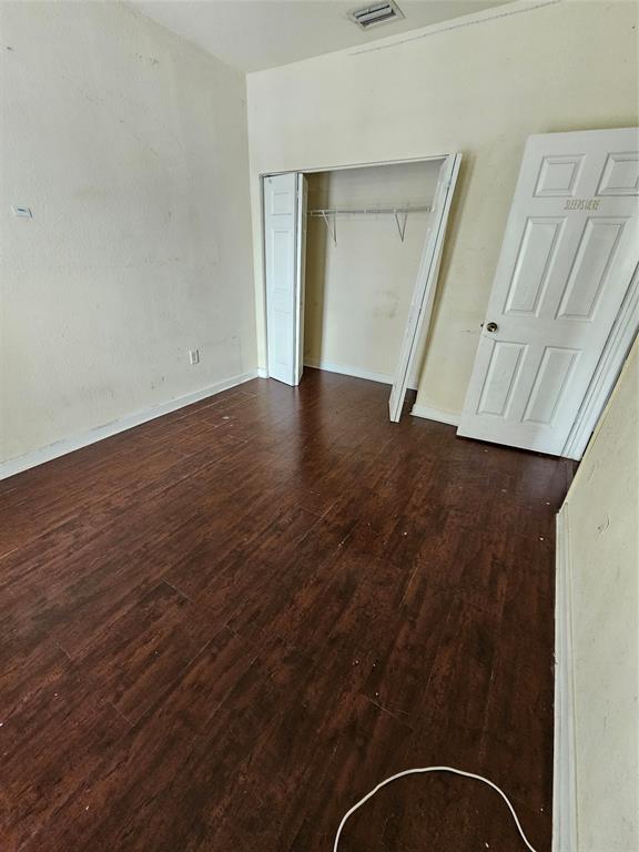 23519 Southwest 112th Court Homestead, FL 33032 - Photo 15 of 19 a view of an empty room with wooden floor