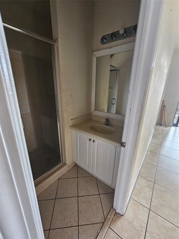 23519 Southwest 112th Court Homestead, FL 33032 - Photo 8 of 19 a bathroom with a sink and a mirror