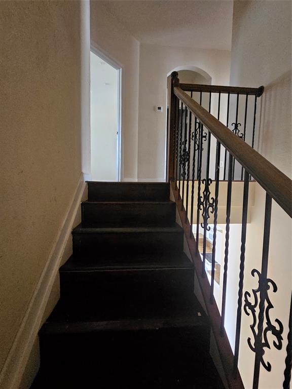 23519 Southwest 112th Court Homestead, FL 33032 - Photo 10 of 19 a view of staircase with lots of frames on wall