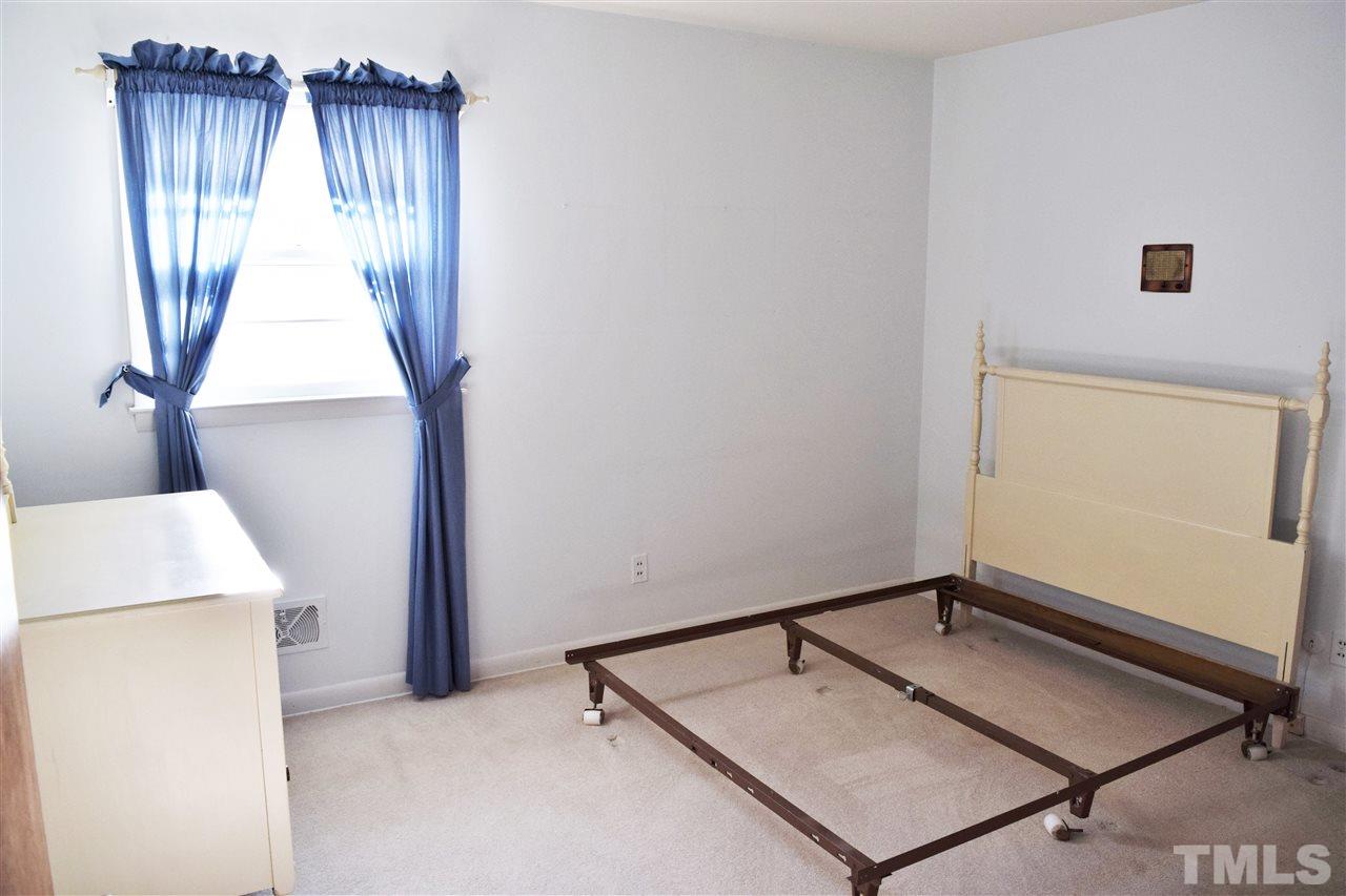 405 Winterlochen Road Raleigh, NC 27603 - Photo 13 of 25 a room with a window and a ceiling fan