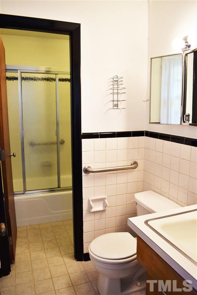 405 Winterlochen Road Raleigh, NC 27603 - Photo 15 of 25 a bathroom with a toilet and a shower