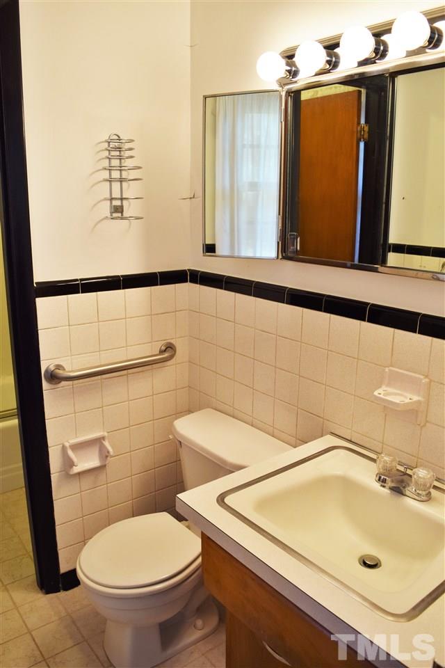 405 Winterlochen Road Raleigh, NC 27603 - Photo 16 of 25 a bathroom with a sink and a toilet