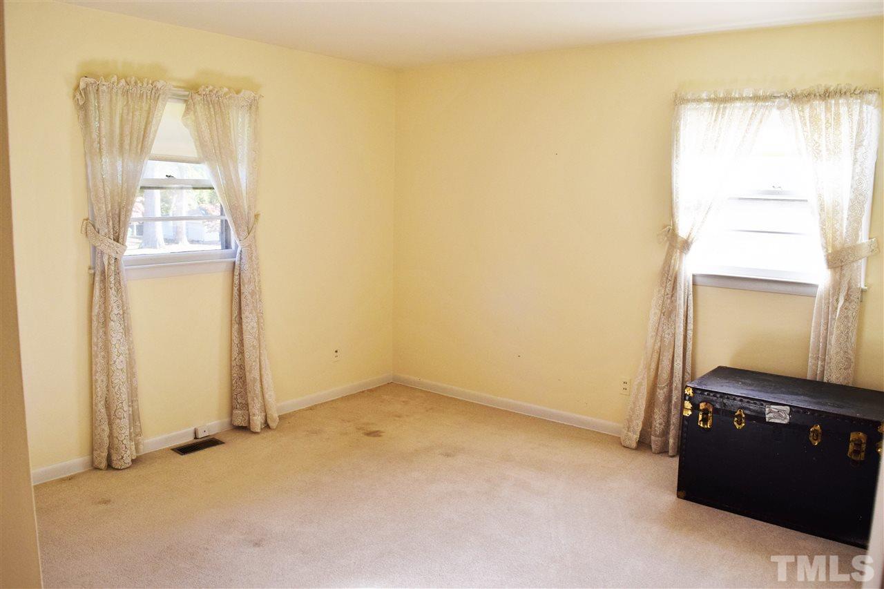 405 Winterlochen Road Raleigh, NC 27603 - Photo 19 of 25 an empty room with windows