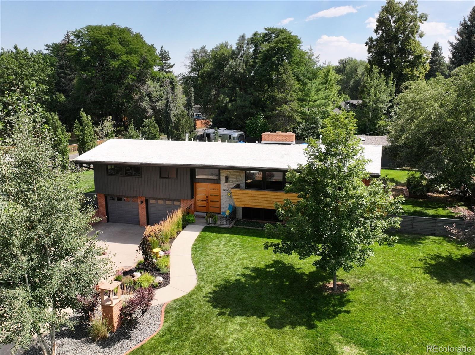 14010 Braun Road Golden, CO 80401 - Photo 1 of 49 an aerial view of a house with swimming pool and garden