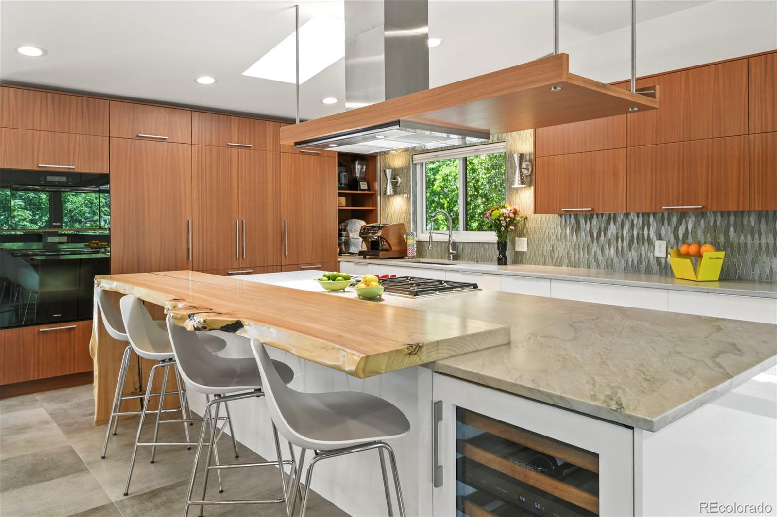 14010 Braun Road Golden, CO 80401 - Photo 12 of 49 a kitchen with a table chairs and a umbrella