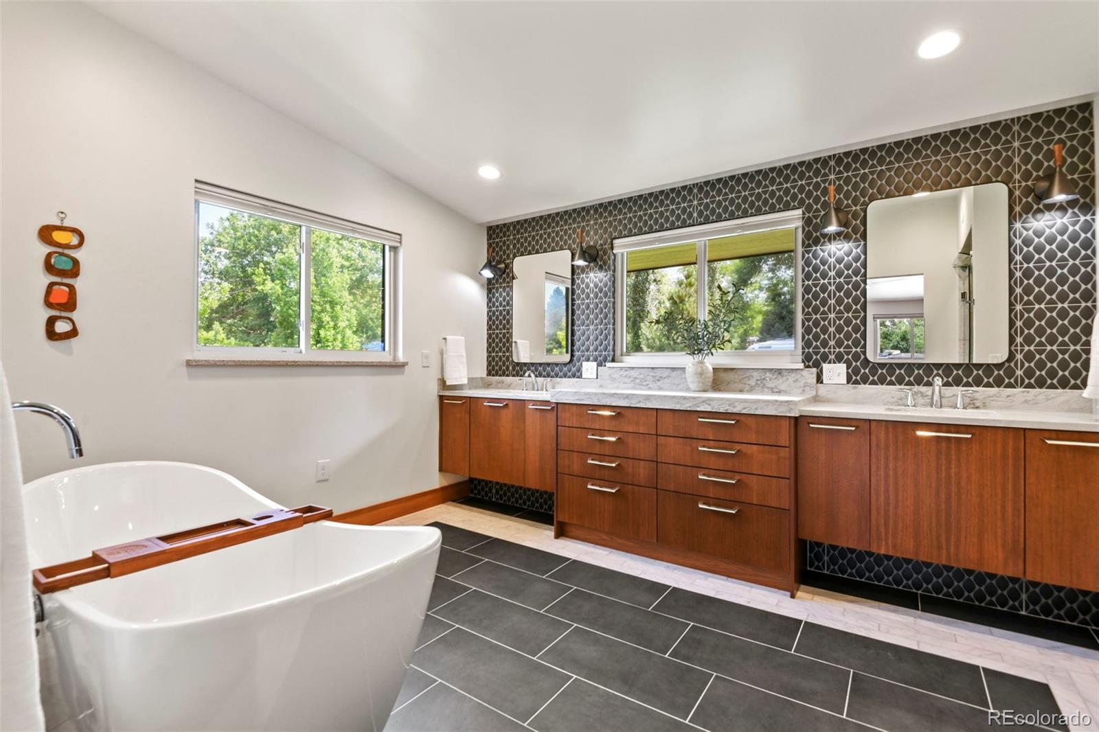14010 Braun Road Golden, CO 80401 - Photo 27 of 49 a spacious bathroom with a bathtub sink and mirror