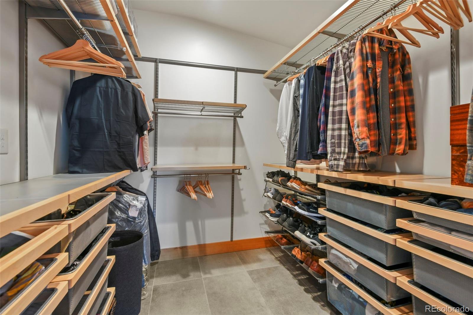 14010 Braun Road Golden, CO 80401 - Photo 29 of 49 a view of walk in closet with clothes and shoes