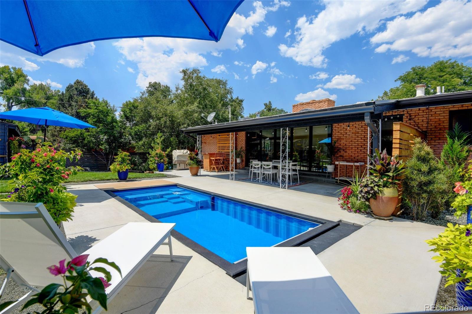 14010 Braun Road Golden, CO 80401 - Photo 41 of 49 a view of a patio with swimming pool table and chairs