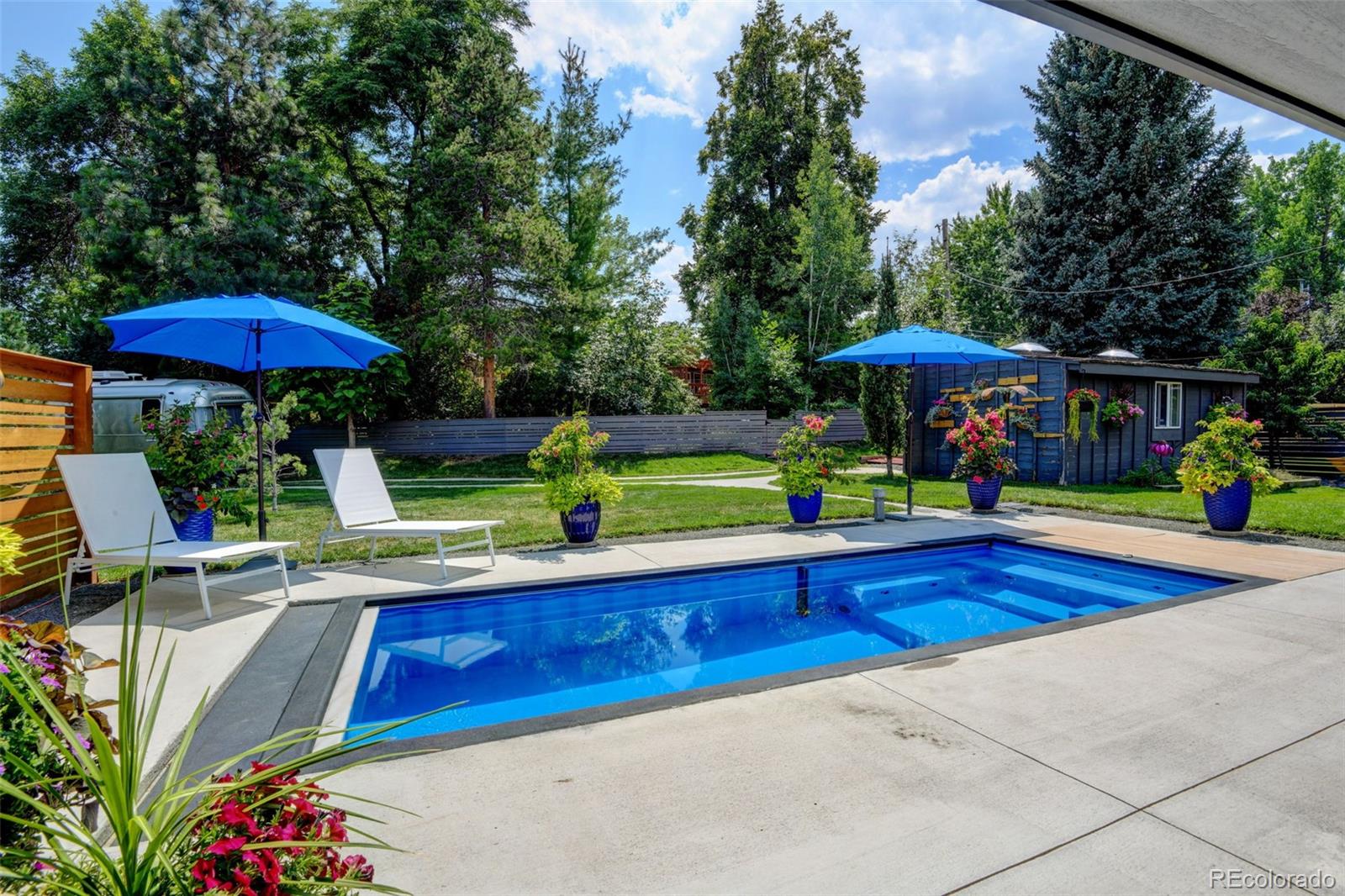 14010 Braun Road Golden, CO 80401 - Photo 42 of 49 a view of a swimming pool with a patio