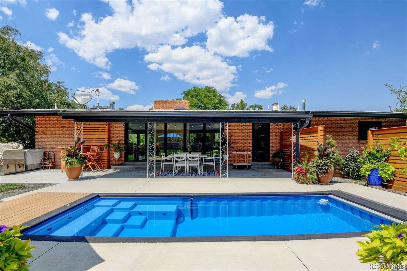 14010 Braun Road Golden, CO 80401 - Photo 44 of 49 a view of a swimming pool with a patio
