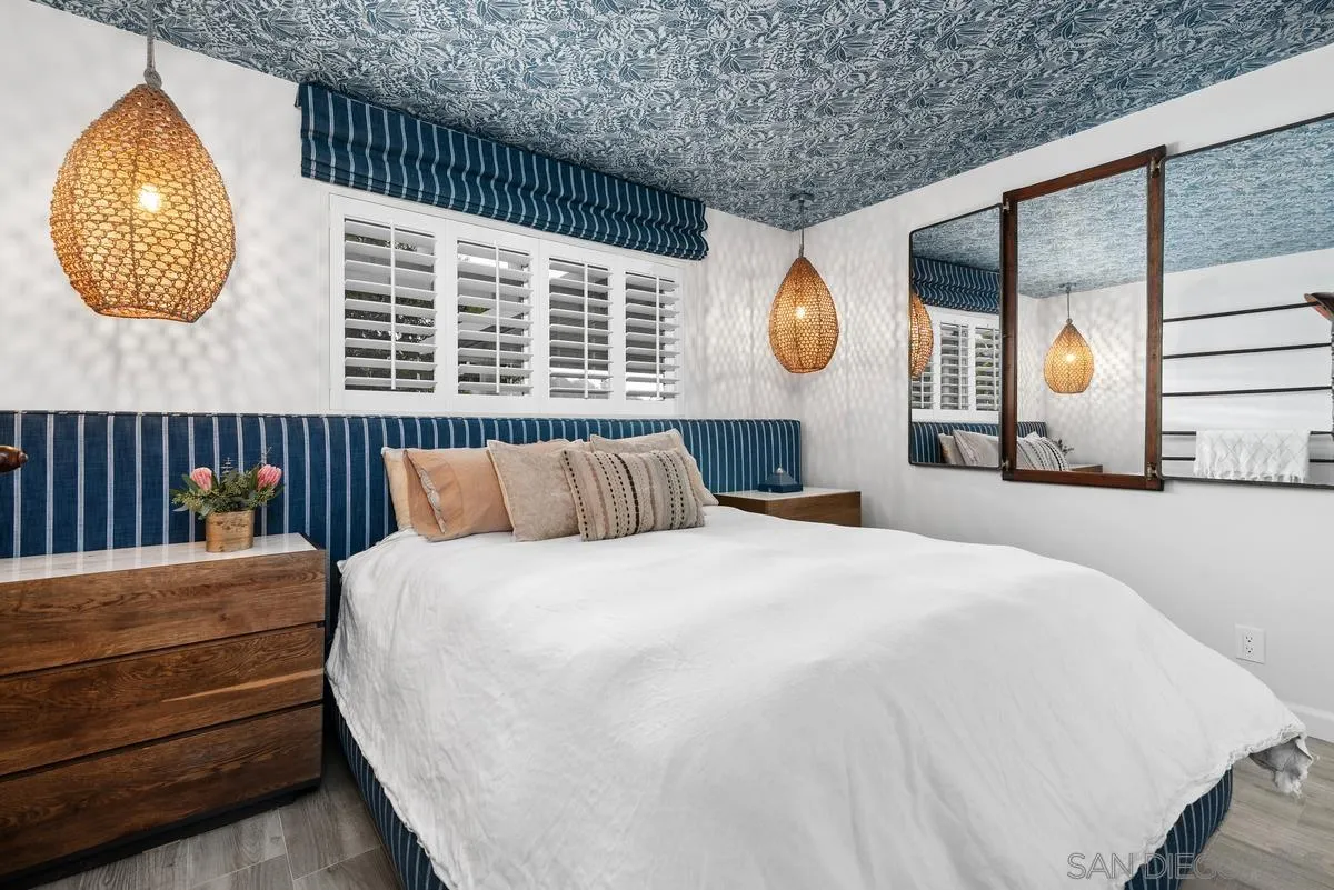 763 Snapdragon Street Encinitas, CA 92024 - Photo 12 of 22 a bedroom with a bed and a painting on the wall