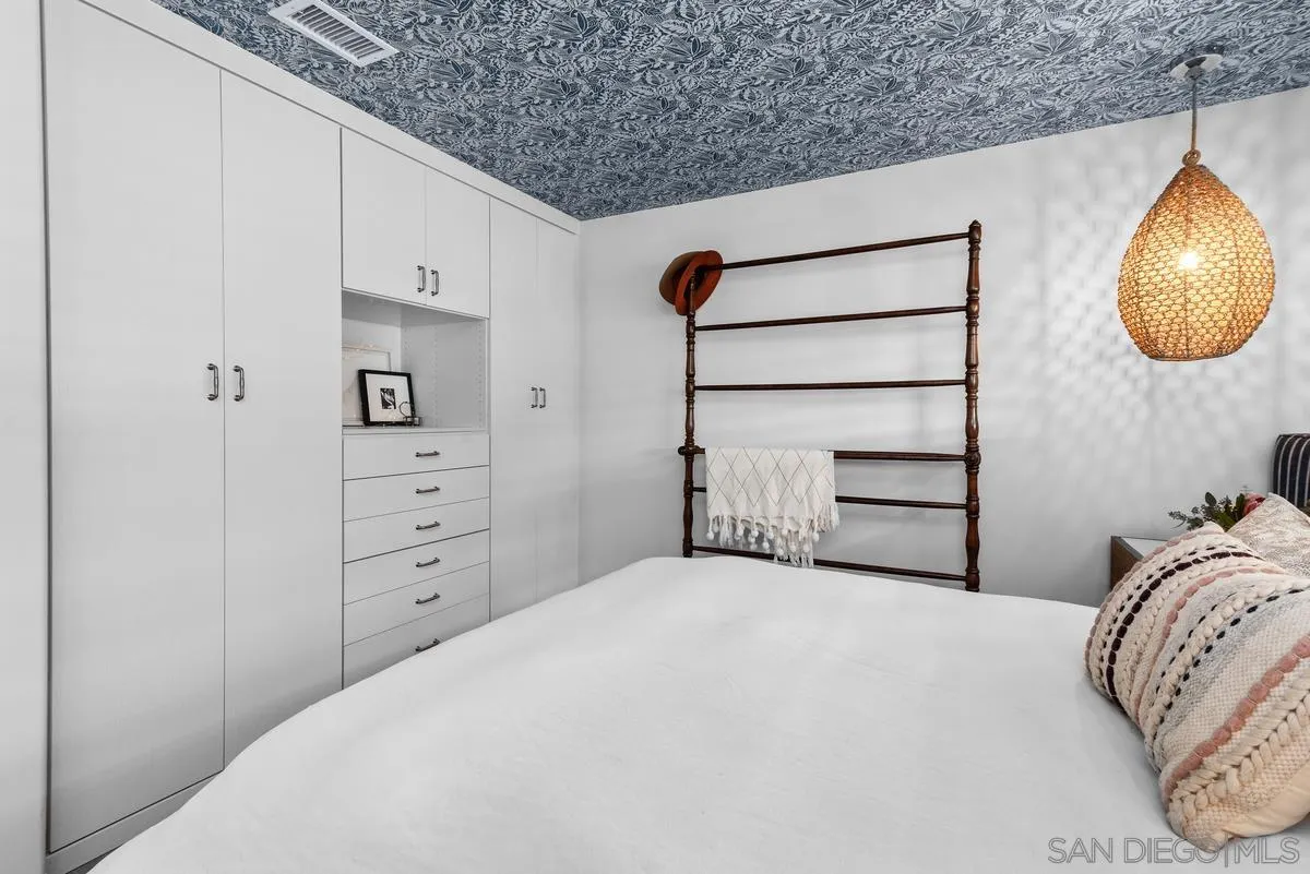 763 Snapdragon Street Encinitas, CA 92024 - Photo 13 of 22 a bedroom with a bed and a painting on the wall