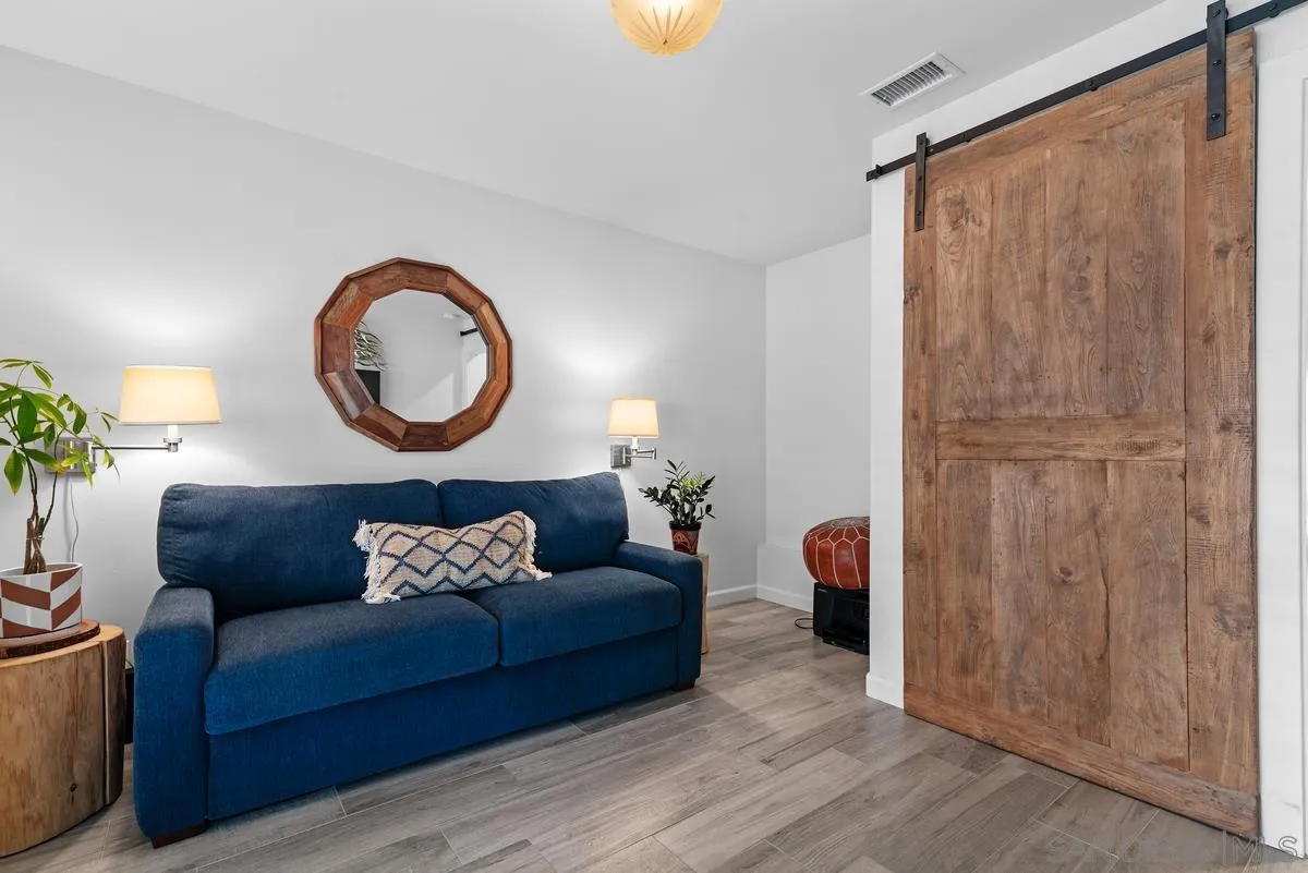 763 Snapdragon Street Encinitas, CA 92024 - Photo 15 of 22 a living room with furniture and a mirror