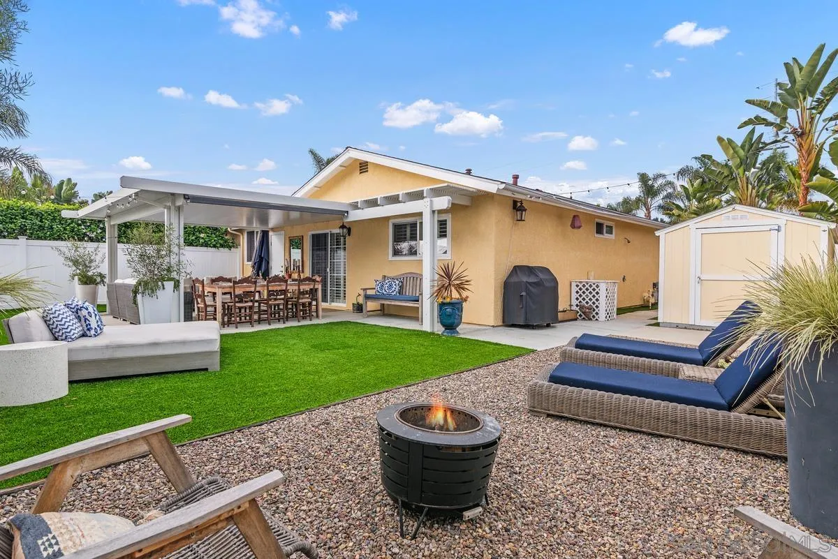 763 Snapdragon Street Encinitas, CA 92024 - Photo 18 of 22 a backyard of a house with table and chairs