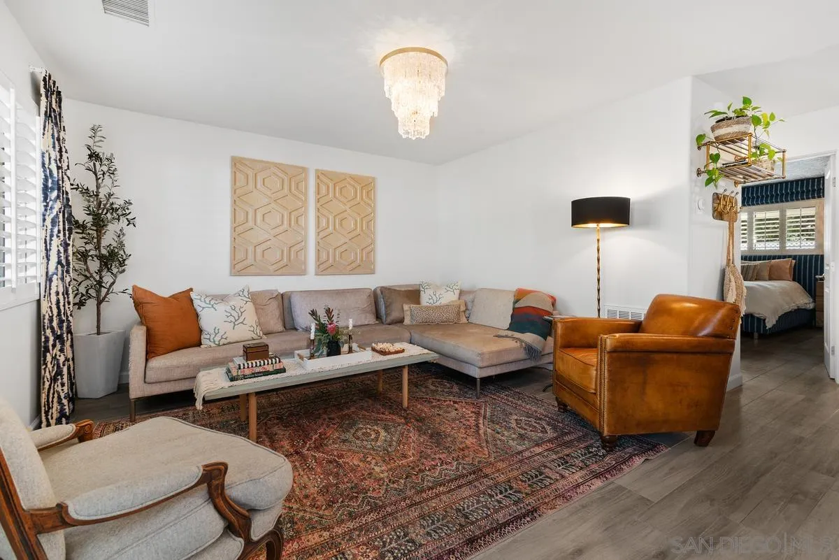 763 Snapdragon Street Encinitas, CA 92024 - Photo 10 of 22 a living room with furniture and a chandelier