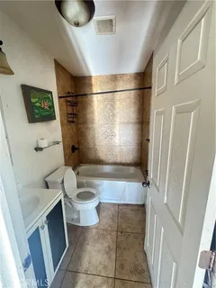 a bathroom with a bathtub and sink