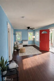 a spacious bedroom with a bed and a large window