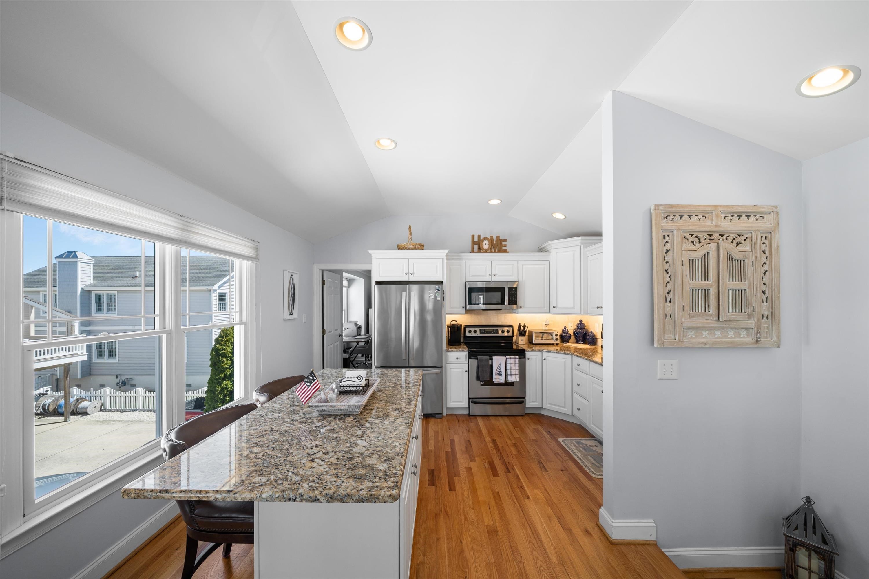 8222 3rd Avenue, Unit NORTH Stone Harbor, NJ 08247 - Photo 14 of 32 a kitchen with a refrigerator and wooden floor