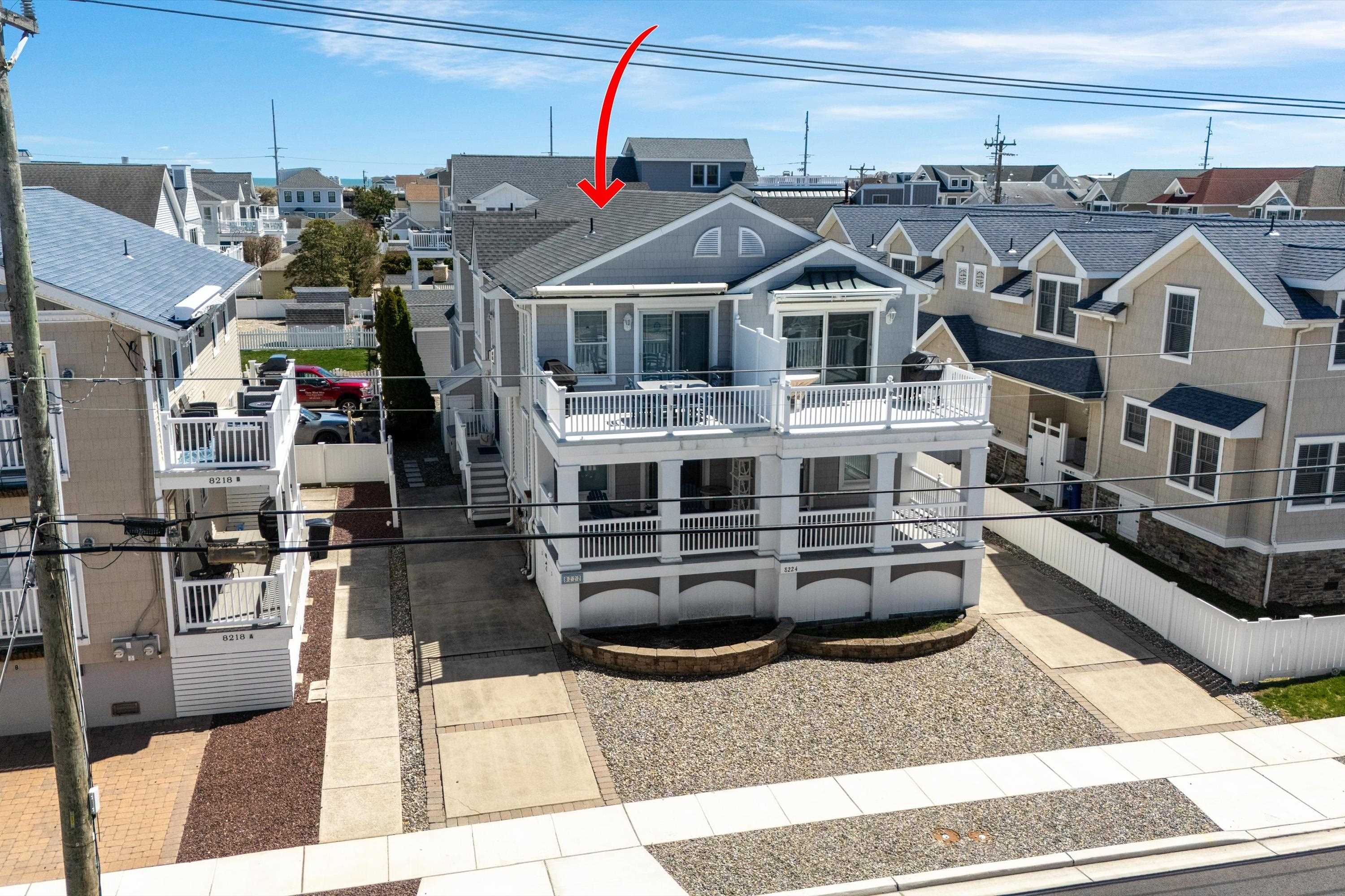 8222 3rd Avenue, Unit NORTH Stone Harbor, NJ 08247 - Photo 2 of 32 a view of a building with many windows