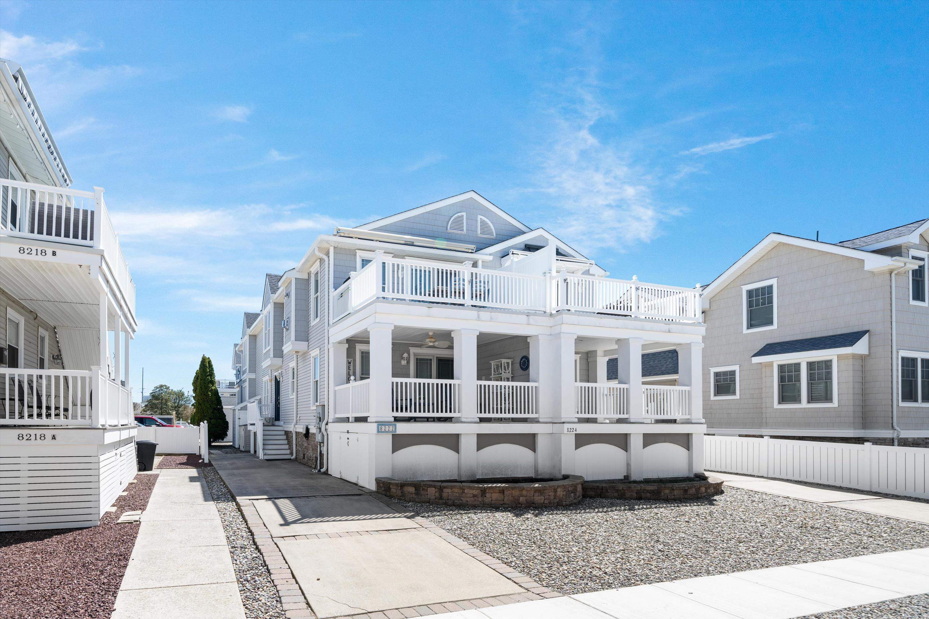 8222 3rd Avenue, Unit NORTH Stone Harbor, NJ 08247 - Photo 25 of 32 a front view of a house with a yard